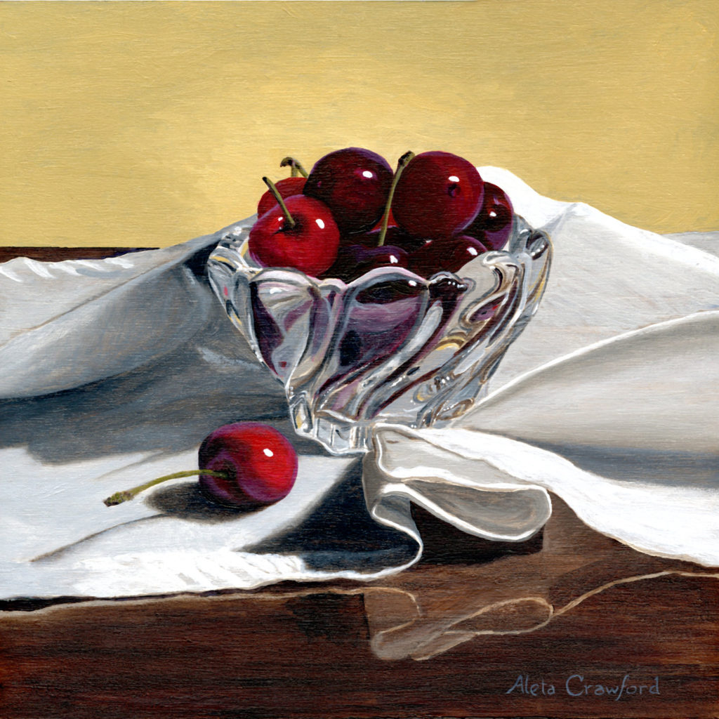 This still life has a handfull of sweet cherries sitting in a crystal bowl on a white napkin. The swirling forms of the glass and the napkin invite you to pluck one cherry for yourself.